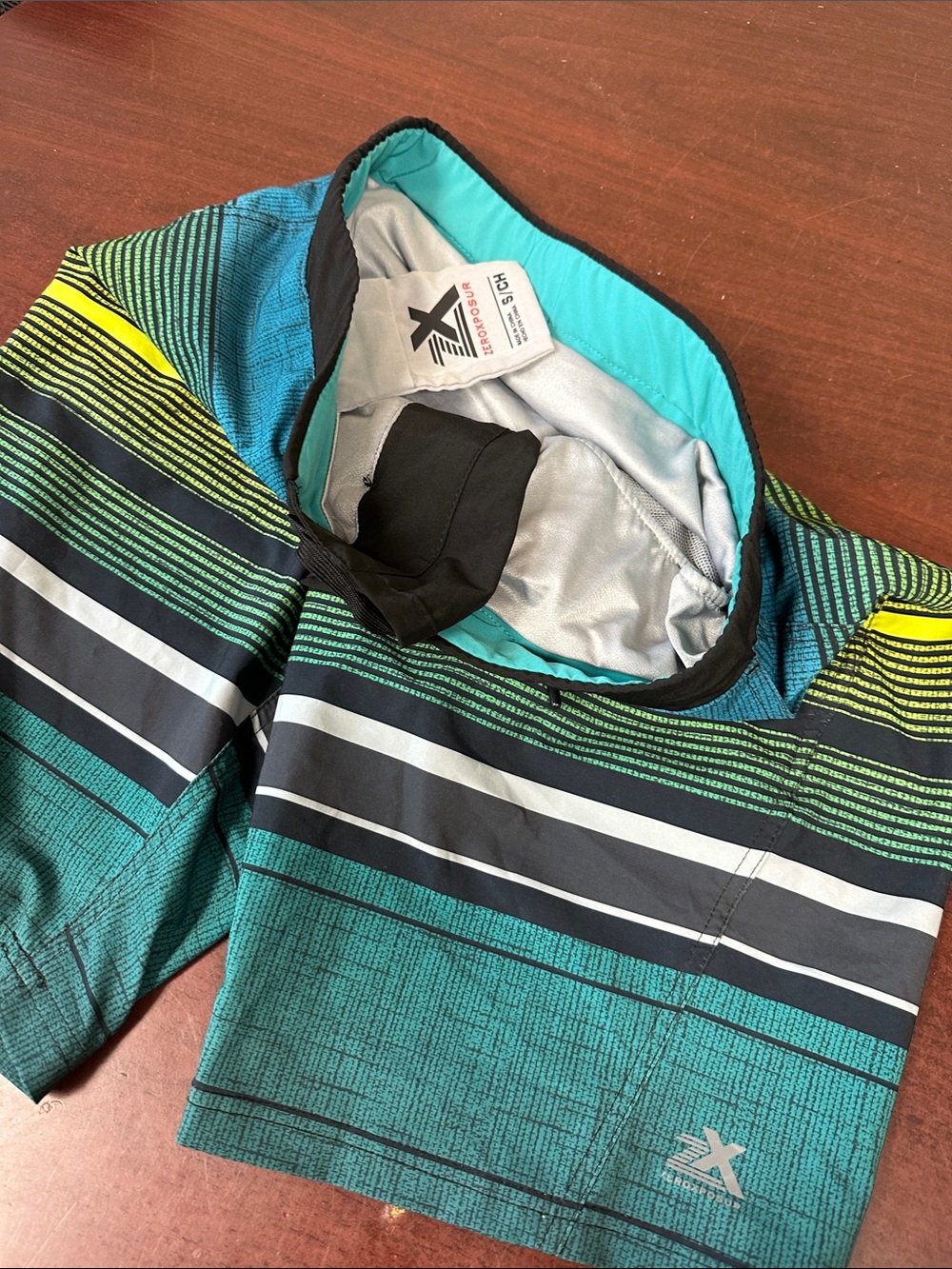 3#450, Xersion Men’s Teal Swim Board Shorts with Black, White & Yellow Stripes